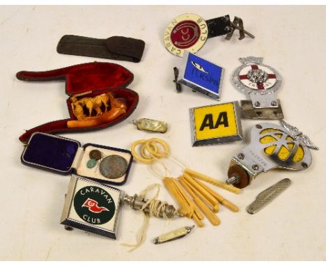A late Victorian carved Meerschaum pipe depicting a lady standing beside a horse (af), various car badges, a whistle, an 1887