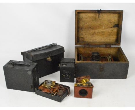 A group of cameras and related items including four plate camera slides, a "Mascot" camera, an Ernemann, etc.