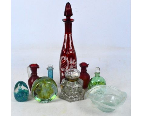 A quantity of glass including a ruby tinted decanter, a large inkwell, a paperweight, etc.
