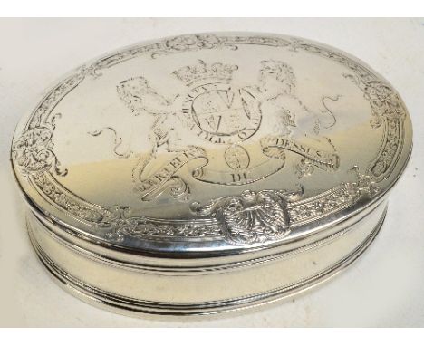 A large early 18th century English white metal military snuff box of oval form, engraved with coat of arms within an ornament