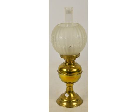 A brass oil lamp with opaque etched glass shade, marked "Duplex Made in England", height including chimney 52cm.