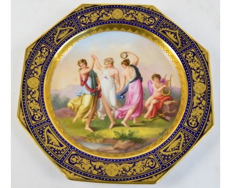 A 19th century Vienna ceramic hand painted and gilt heightened cabinet plate of octagonal form depicting dancing graces and s