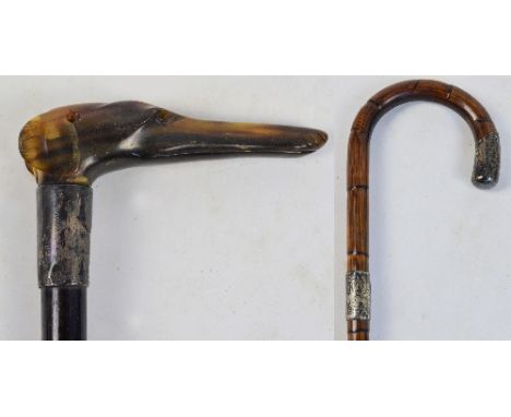 A hallmarked silver mounted ebonised walking stick, with carved horn handle modelled as a greyhound's head, hallmarked for Ch