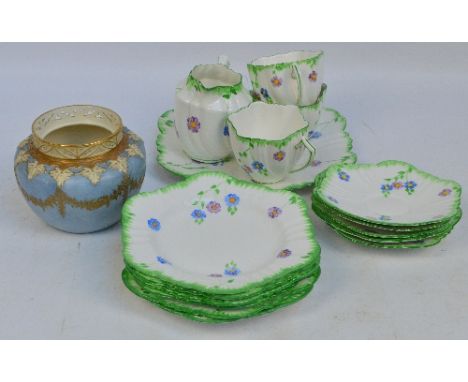 A Phoenix China Thomas Forester & Sons Ltd floral hand painted part tea service comprising three cups, five saucers, six larg