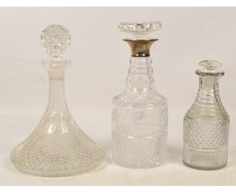 A hallmarked silver collared clear cut glass decanter of cylindrical form with tapering neck and stopper, London 1962, height