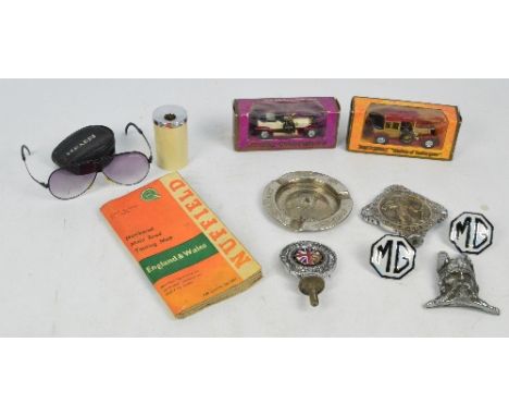 A group of collectors' items relating to cars including an MG badge, Royal Automobile Club Association badge, two model cars,