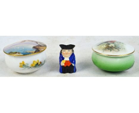 A Royal Worcester circular trinket box and cover, the lid painted with a robin and signed H. Powell and a further circular tr