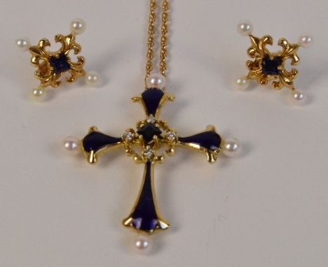 A 14ct yellow gold Franklin Mint Ltd "Midnight Sapphire" cross pendant from the Igor Carl House of Faberge Collection, centre