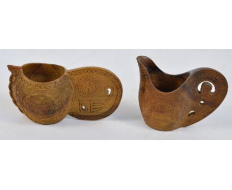 Two 20th century Scandinavian carved wooden kovsh cups with incised decoration, length 12cm and 14.5cm including handles (2).