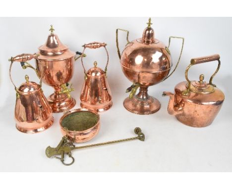 A collection of large copper ware items comprising a large copper kettle, a globular tea urn with brass handles and circular 