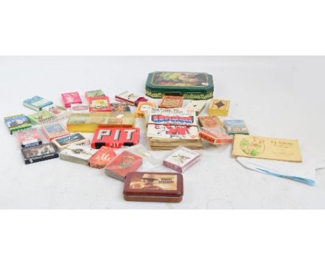 A collection of various playing cards to include "Period Pieces", "Monarchs of England", and "Wild West" card games and tarot