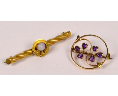 An Edwardian 15ct yellow gold circular open work brooch centred with two trefoils with cut amethyst and three seed cultured p