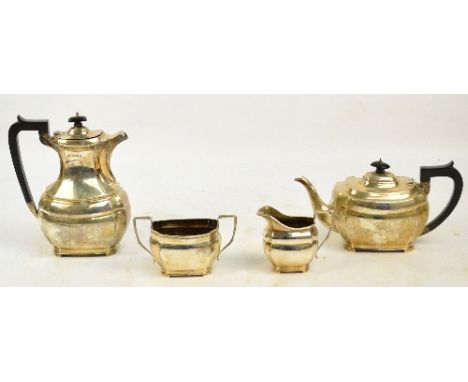 A George VI hallmarked silver four piece tea service of panelled rounded rectangular form, Robert Pringle & Sons, London 1945
