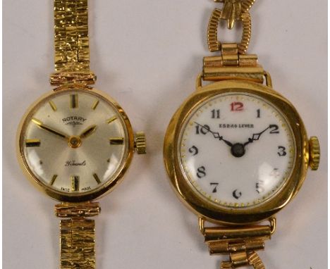 ROTARY; a lady's vintage 9ct gold wristwatch with integral textured brick link gold bracelet, and a further gold cased lady's