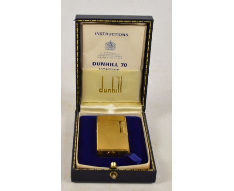 A boxed Dunhill 70 Rollagas lighter, 6 x 3cm, with instructions booklet.