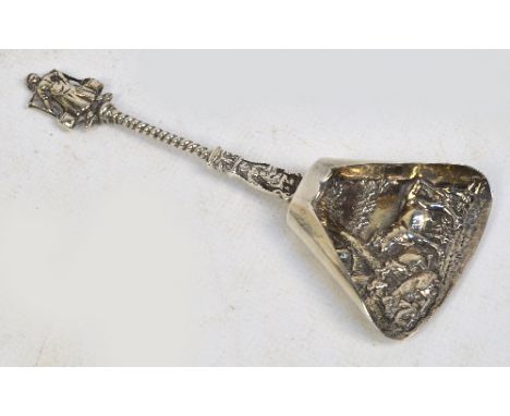 A mid to late 20th century Dutch silver caddy spoon with twisted stem and cast figural finial, the tapering bowl decorated wi