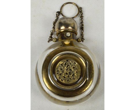 An unusual late Victorian/Edwardian combination scent bottle/vinaigrette, the domed cover above a rounded glass body set to t