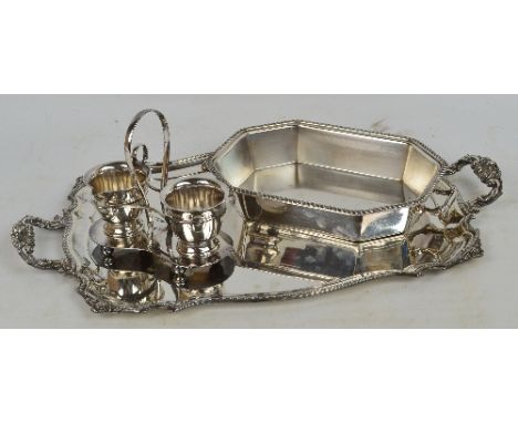 A silver plated twin handled tray of shaped rectangular form with scallop decoration to the rim and handles, the top plain, w