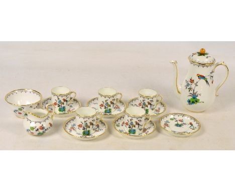 A Tuscan china part coffee set decorated with colourful birds on branches, on a white ground with gilt rims and handles, comp