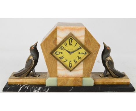An Art Deco French eight day mantel timepiece with coloured marble pieces forming a geometric pattern with spelter birds on e