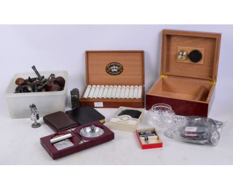 A box of twenty-five medallion Petit Coronas Havana Tobacco cigars, a wooden cigar humidor, 22 x 26 x 11cm, a group of leathe