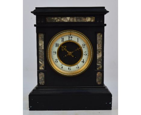A large late 19th century black slate and marble detailed eight day mantel clock, the circular dial set with Arabic numerals,