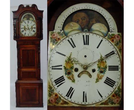 An early 19th century mahogany longcase clock, the swan neck pediment above arched painted dial indistinctly inscribed and wi