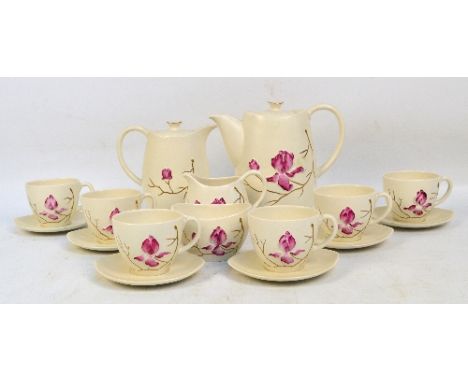 A Carlton Ware coffee set in pink "Magnolia" embossed pattern with gilt twigs comprising coffee pot, water jug, jug and bowl,