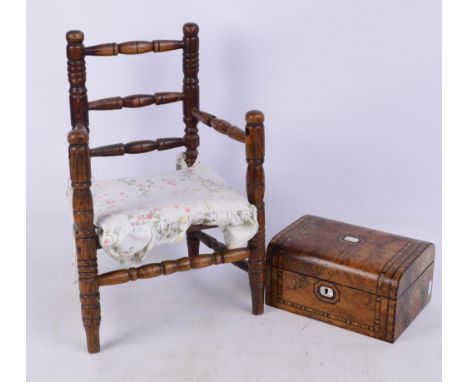 A late Victorian burr walnut and inlaid sewing box centred with a vacant mother of pearl cartouche and escutcheon, the hinged