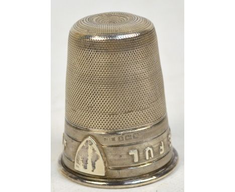 An early 20th century hallmarked silver shot cup in the form of a thimble, inscribed "Just a thimble full", marks illegible, 