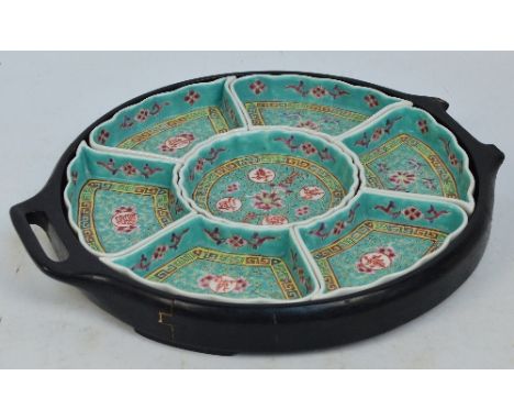An early to mid 20th century Chinese ceramic sectional circular foot dish painted enamels with floral sprays and auspicious c