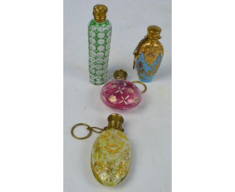 A pale green and clear Bohemian cut scent bottle with tapering body and gilt metal cap, a pale cranberry tinted and enamel de