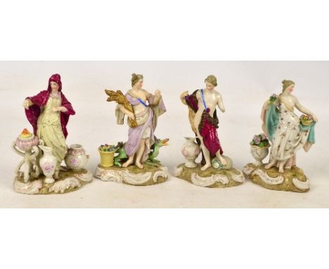 Four 20th century Italian ceramic figures for the seasons, including summer with a sheath of corn, spring with flowers, autum