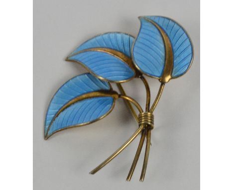 A Norwegian sterling silver gilt and blue guilloche enamel decorated foliate brooch modelled as three overlapping leaves, Alb
