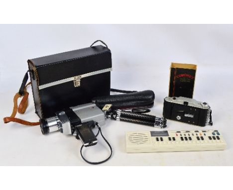 A boxed coronet folding pocket camera, a Yashica cine camera in carrying case with remote control flex, a cased folding Minet