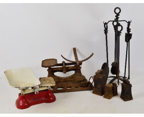 A quantity of metalware including two sets of kitchen scales, a large 7lb weight, fire tools etc.