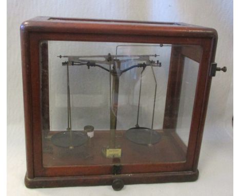 A mid 20th century mahogany cased set of scientific scales, with ivorine label 'Model 21a' 65x61cm  