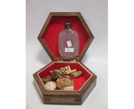 A silver mounted cut glass flask in a parquetry box with objets virtu  