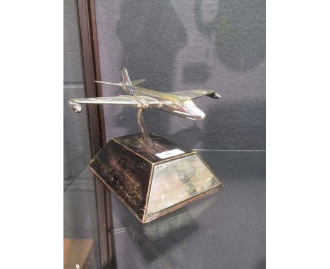 A presentation silver plated model of a jet fighter, on wood stand with presentation plaque, 'presented to Air Marshall Sir W