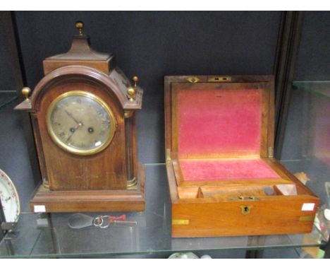 An Edwardian mahogany bracket clock, in Sheraton revival style with brass stringing; a 19th century mahogany writing slope (2