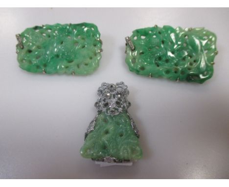 Two jade and rose cut diamond pendants with subsequant brooch conversions and a simulated jade and marcasite clip (3)  