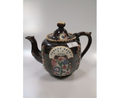 A 19th century bargeware teapot and cover, applied with a plaque incised 'Joseph Sale 1884'  