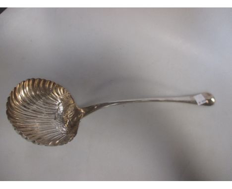 A silver 'rat tail' pattern shell bowl soup ladle possibly by George Baskerville, London 1757, crested 4.2ozt  