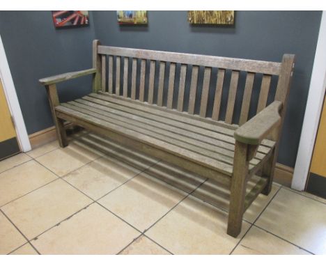 A teak garden bench in the manner of Barlow Tyrie 191cm wide  
