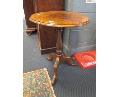 A 19th century walnut quarter veneered tripod table, 70cm high  