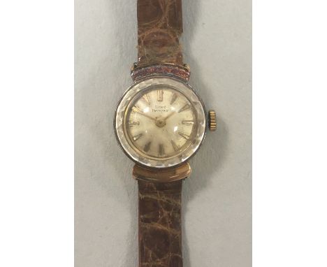 Girard Perregaux - A lady's 18ct gold wristwatch, the circular signed champagne dial with gold coloured batons and hands and 