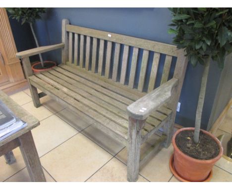 A Barlow Tyrie teak garden bench together with a Barlow Tyrie garden table (2)  