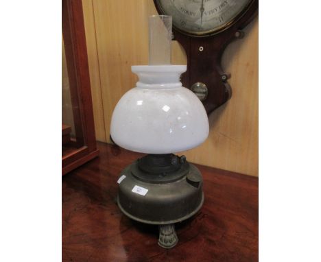 An oil lamp together with spare shades etc  