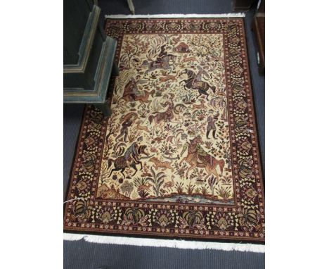 A woollen prayer rug, 180 x 125cm together with a machine woven rug depicting a hunting scene, 160 x 112cm (2)  