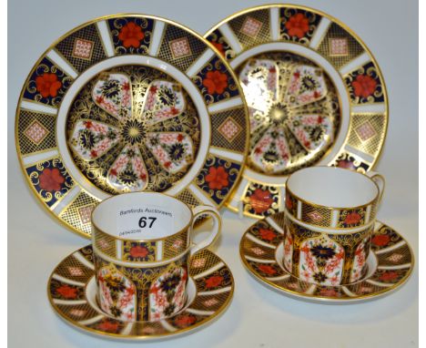 A pair of Royal Crown Derby 1128 side plates, printed marks; a pair of Royal Crown Derby 1128 coffee cups & saucers (4)